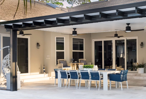Dark aluminum patio cover over outdoor dining area – Pivot Patio & Exteriors