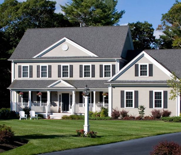 New siding and windows on two-story colonial home – Pivot Patio & Exteriors